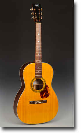 Lyon Triple-O
Sitka spruce top, rosewood sides and top
Rosewood fingerboard and bridge
39 X 14.75 X 4.2 inches